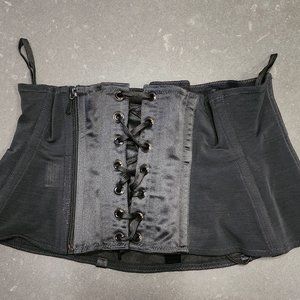 Black corset by Cadolle